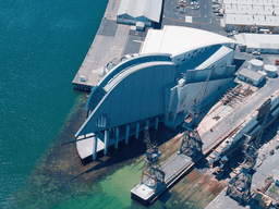 A view from high above the Museum, we can see three historic loading cranes and the Ovens submarine.