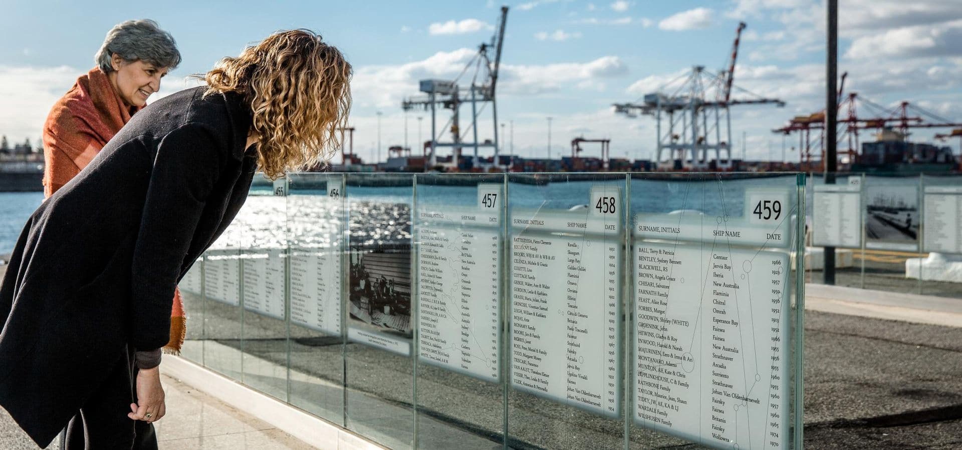 Outside the Museum, the glass and metal panels are where names of migrants, their dates of arrival and their ships are listed.