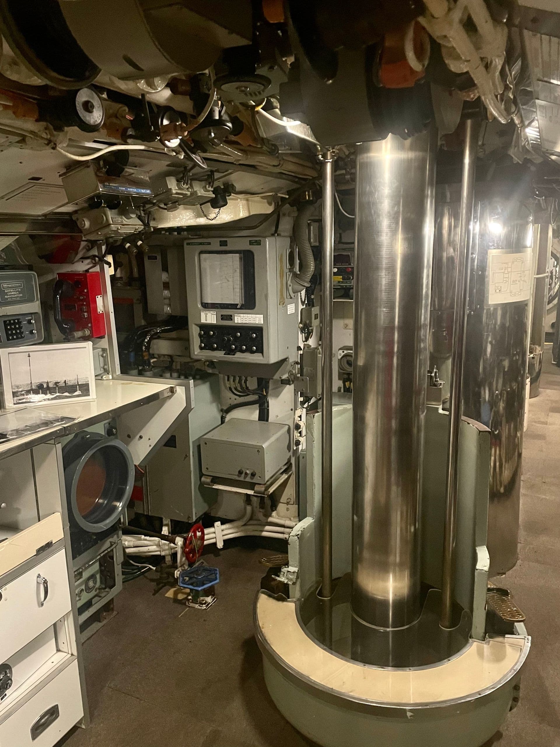The submarine's periscope has been stowed away, so its thick metal piston is in its place.