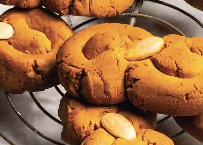 golden baked biscuits with an almond in the centre