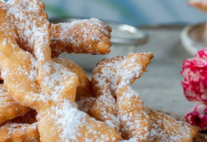 Biscuits baked in a twisted shape and dusted with icing sugar.