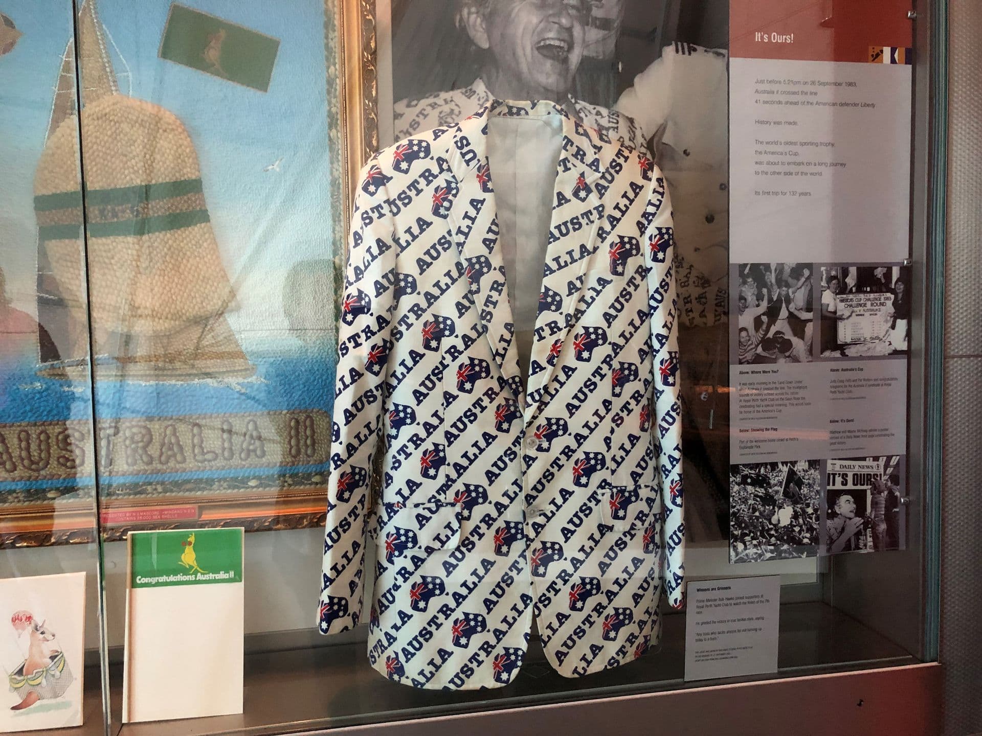A white men's jacket with "Australia" and Australian iconography repeated over its entire surface.
